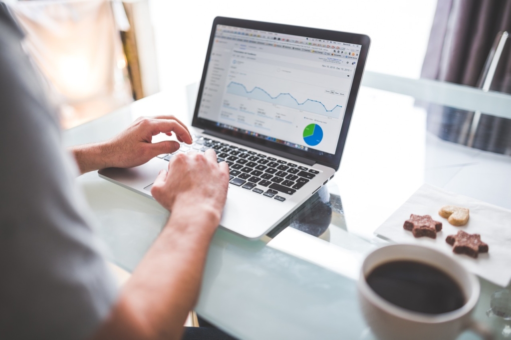 A person with a digital chart displaying financial data